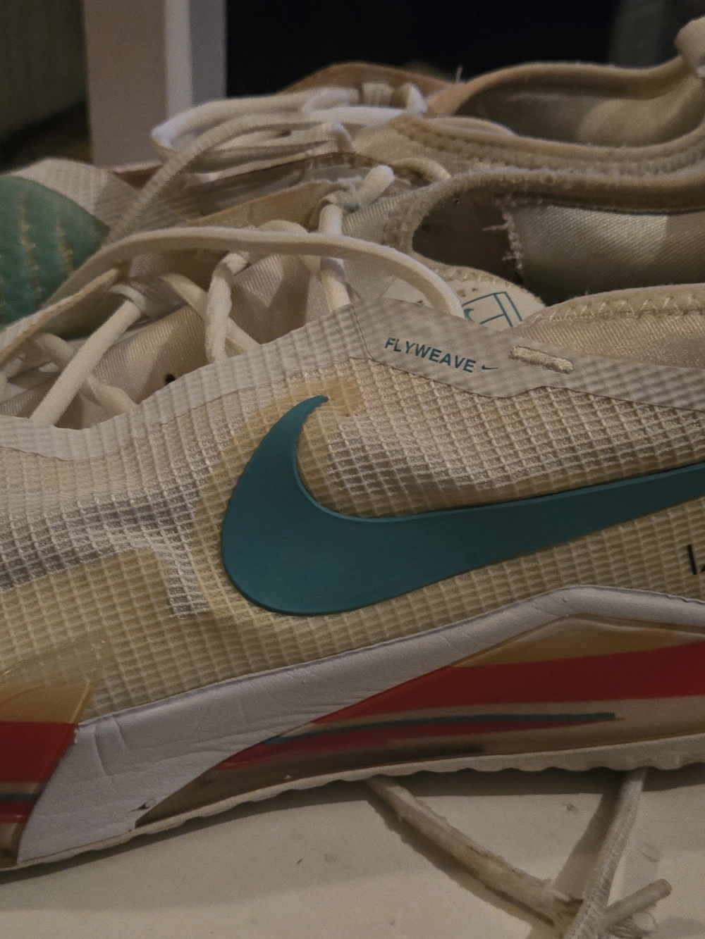 Nike White Sneakers with Teal Swoosh and Multicolor Midsole